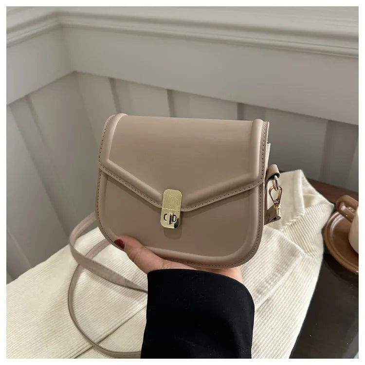 Soft PU leather messenger bag with clamshell opening in black, dark brown, khaki or white.