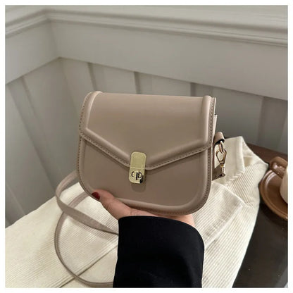 Soft PU leather messenger bag with clamshell opening in black, dark brown, khaki or white.