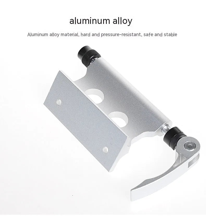 Silver metal quick-release clamp for attaching a bicycle front fork to a vehicle rack.