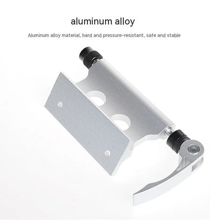 Silver metal quick-release clamp for attaching a bicycle front fork to a vehicle rack.