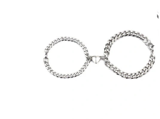 Fashionable titanium steel couple bracelets in gold and silvery colors, showcasing the minimalist and sleek design