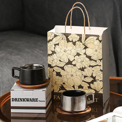 Office gift set showing stainless steel travel tumbler inside a gold-plated presentation box with optional gift bag.