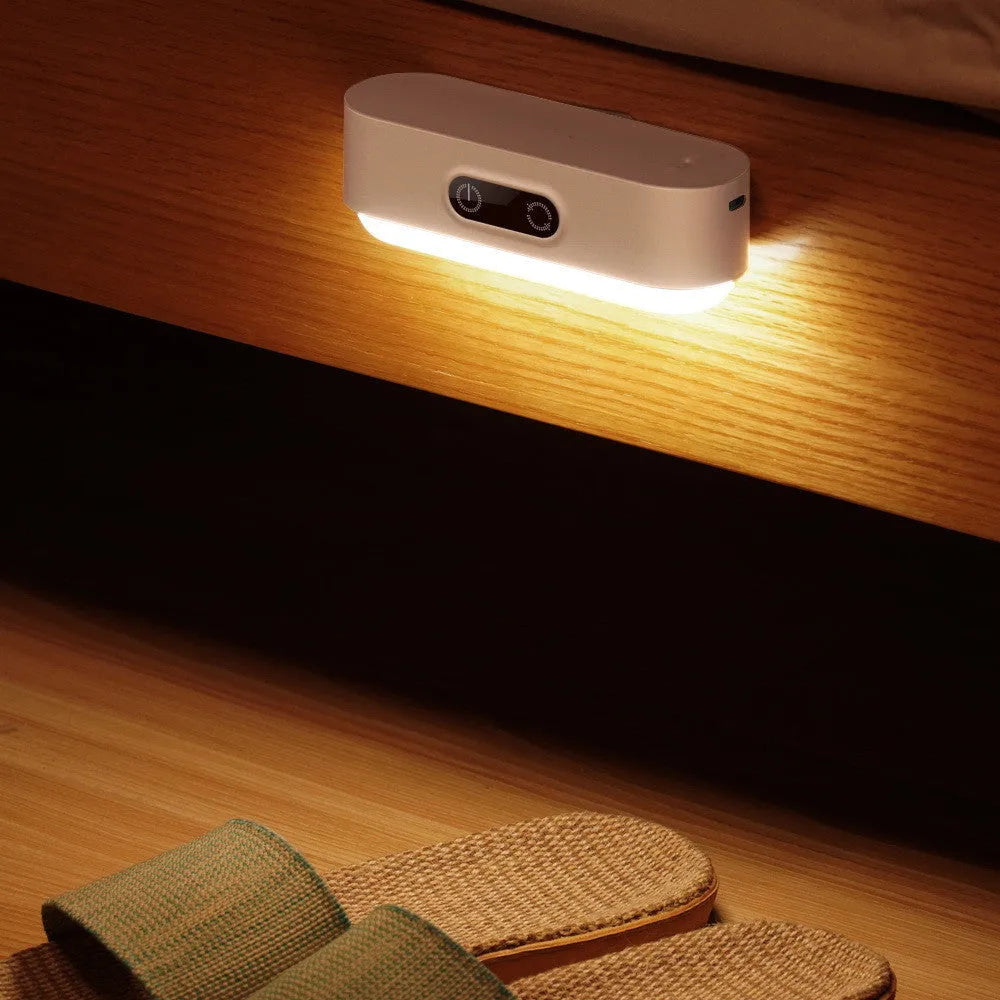 White magnetic mount USB rechargeable LED night light with motion sensor and touch control panel.