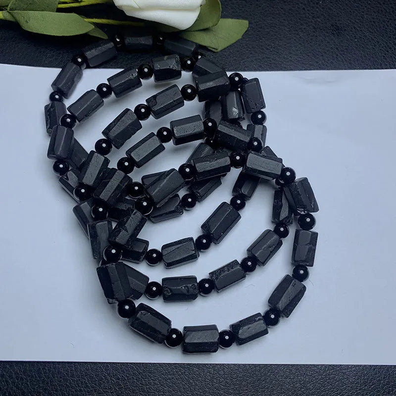 Natural black tourmaline rough stone bracelet with stretch cord on wrist