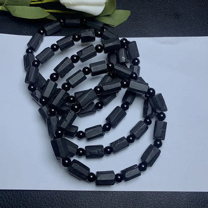 Natural black tourmaline rough stone bracelet with stretch cord on wrist