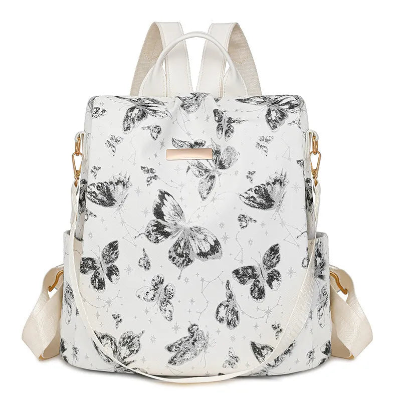 Butterfly printed large capacity PU backpack in various colours with sewing line details and an ergonomic back.