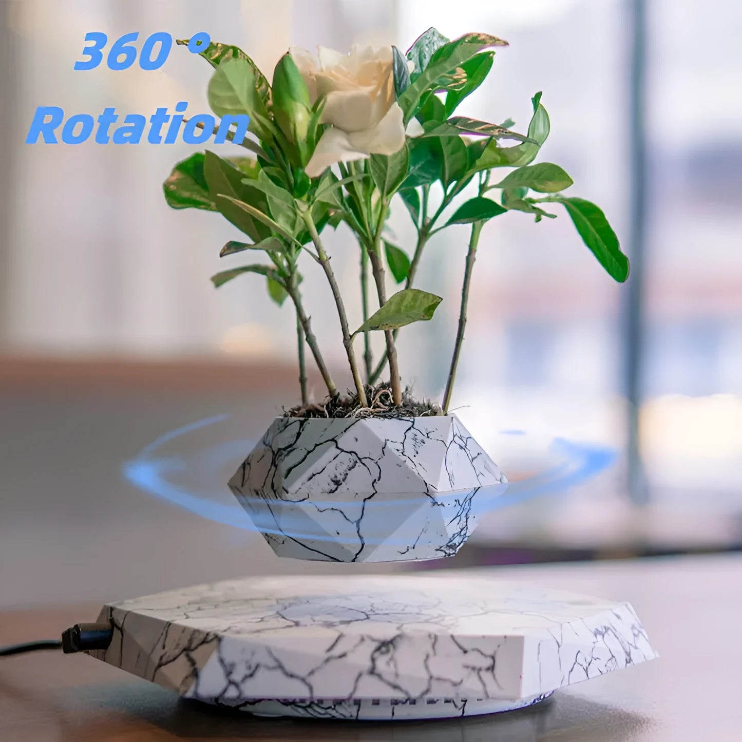 Marbling colour magnetic levitating plant pot floating above base with small plant inside