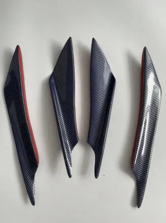 Set of four carbon fibre pattern ABS plastic bumper blades for car modification.