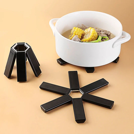Versatile folding pan mat made of heat-resistant ABS material, with an anti-slip surface to protect kitchen surfaces from hot cookware
