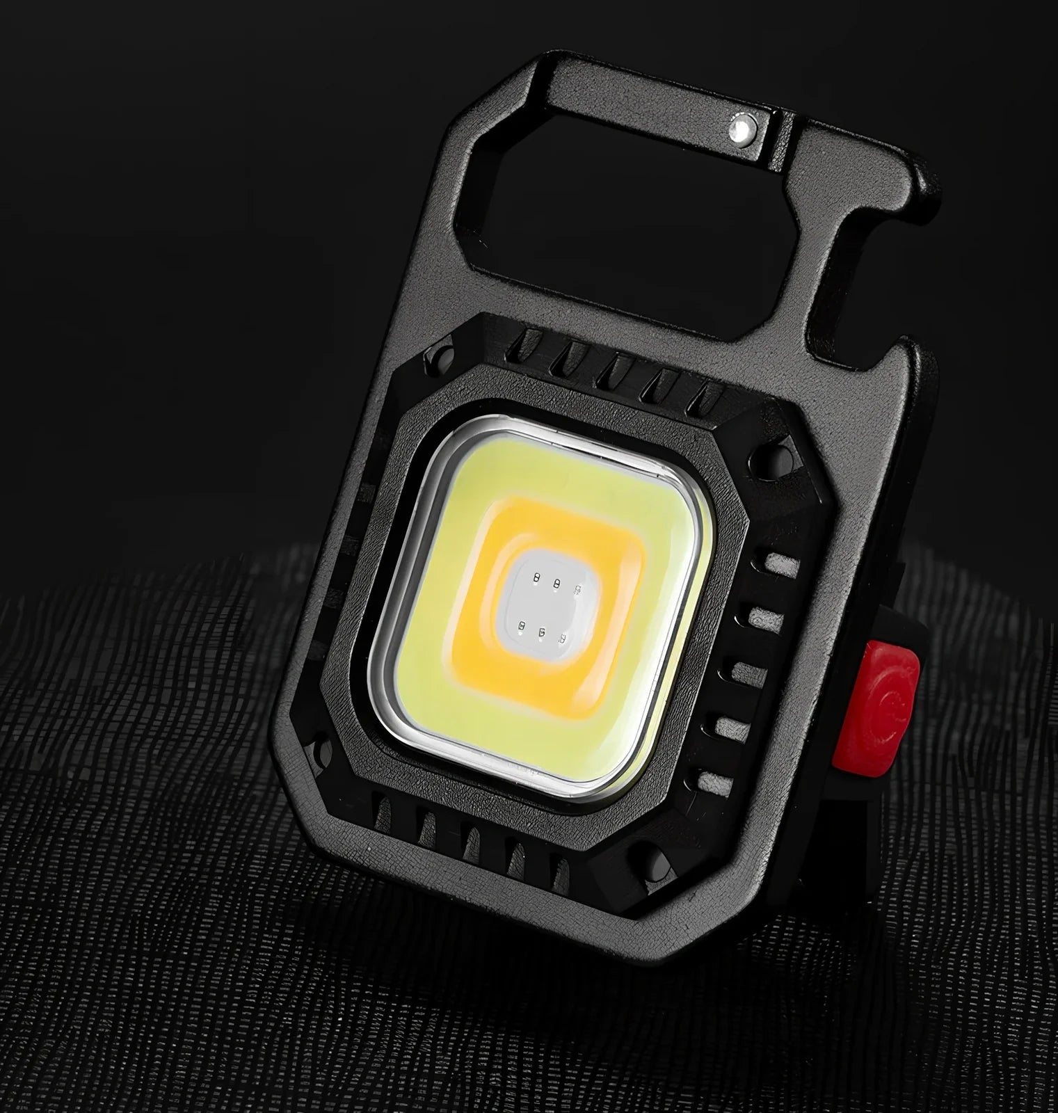 Black portable LED torch showing magnet, bottle opener, and multiple light modes with 500lm brightness