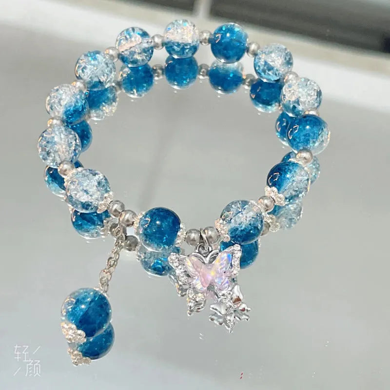 Chinese style glass bead bracelet with bamboo joint design on wrist.