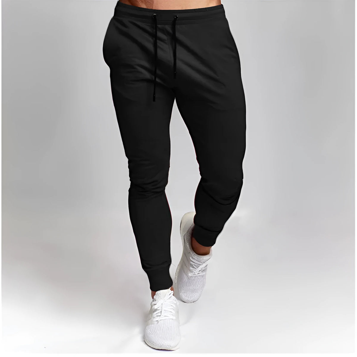 Men's cotton skinny sports trousers with drawstring and belt, available in five solid colours