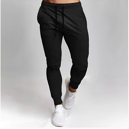 Men's cotton skinny sports trousers with drawstring and belt, available in five solid colours