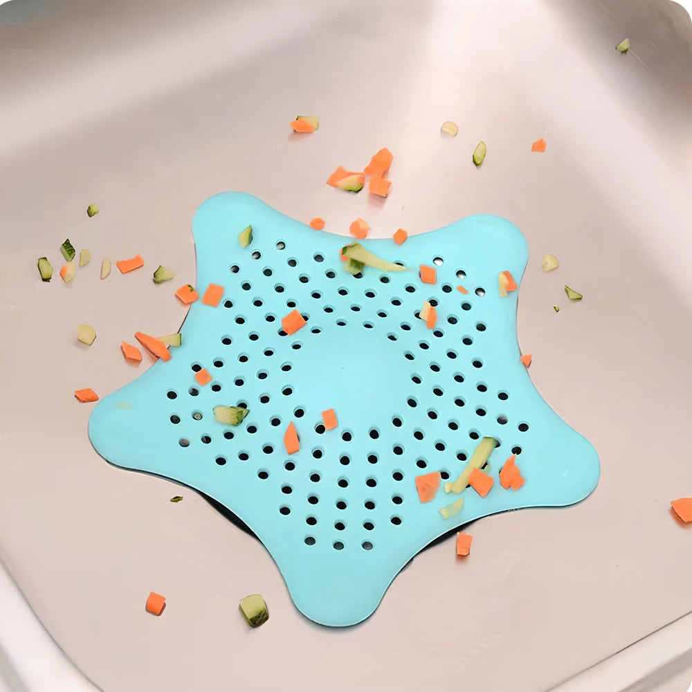 Three starfish-shaped sink drain filters in white, blue and green colours showing suction cups on bottom