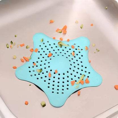 Three starfish-shaped sink drain filters in white, blue and green colours showing suction cups on bottom
