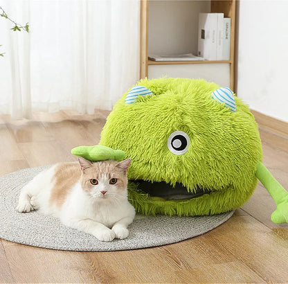 Round fluffy plush cat bed with a non-slip bottom, shown in a medium 40cm size on a wooden floor.