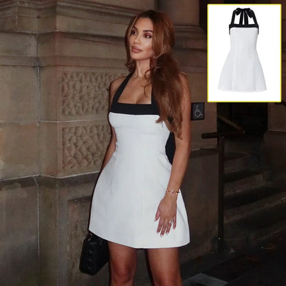 Chic off-shoulder mini dress with halter neckline, sleeveless design, and contrasting white and black colors