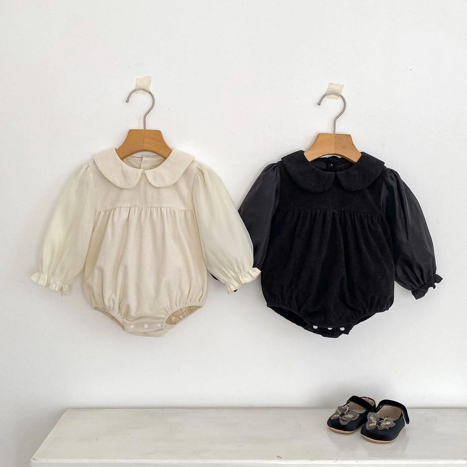 Corduroy doll collar long sleeve baby romper in black or apricot with single-breasted closure