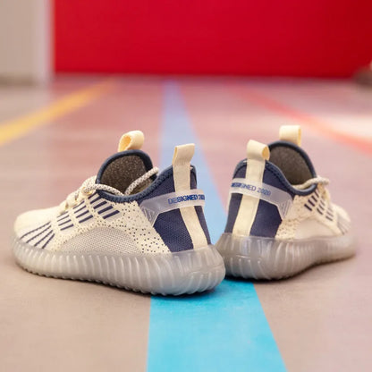 Men's low-top white mesh sneakers with a round toe and flat platform sole on a plain background.