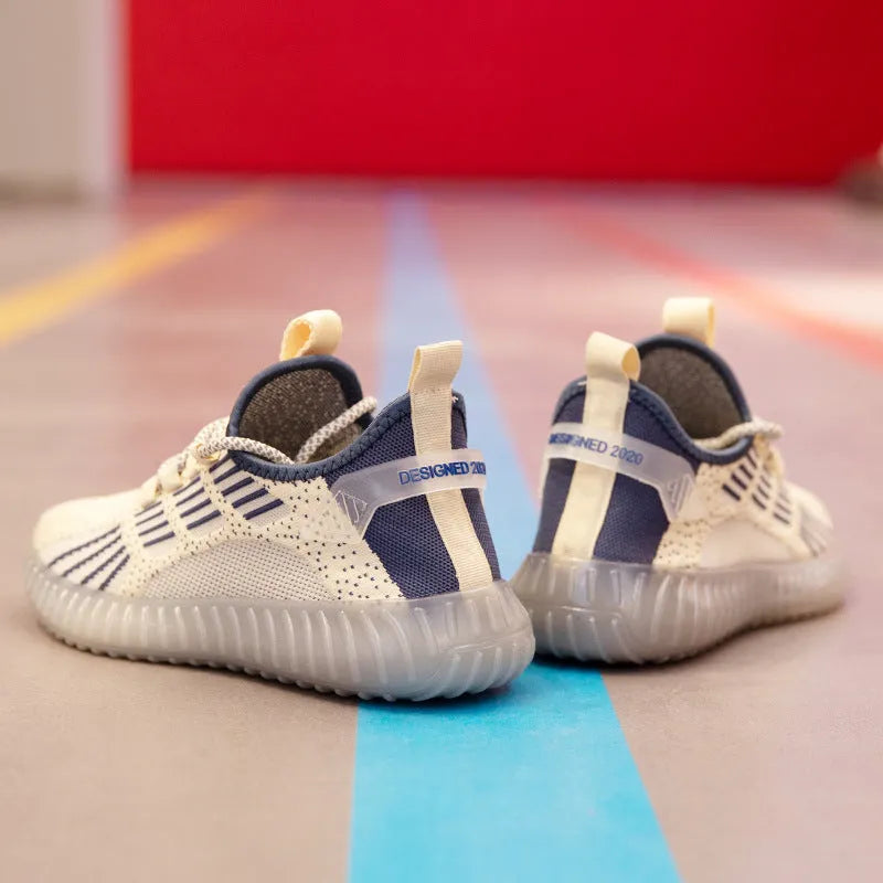 Men's low-top white sneakers with breathable fabric upper and flat platform sole on a grey background.