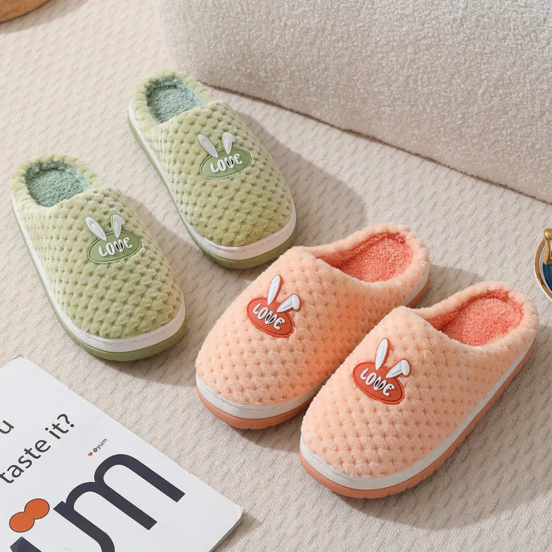 Women's plush rabbit plaid design winter slippers with a thick light-coloured rubber sole.