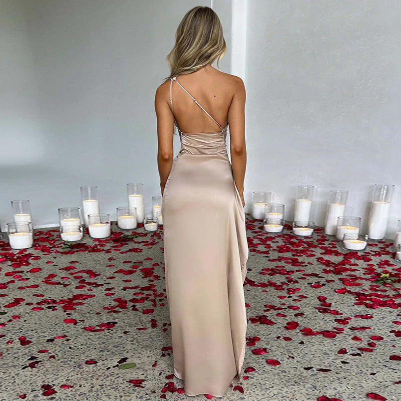 One-shoulder backless slit dress made of luxurious satin, available in a variety of vibrant colors