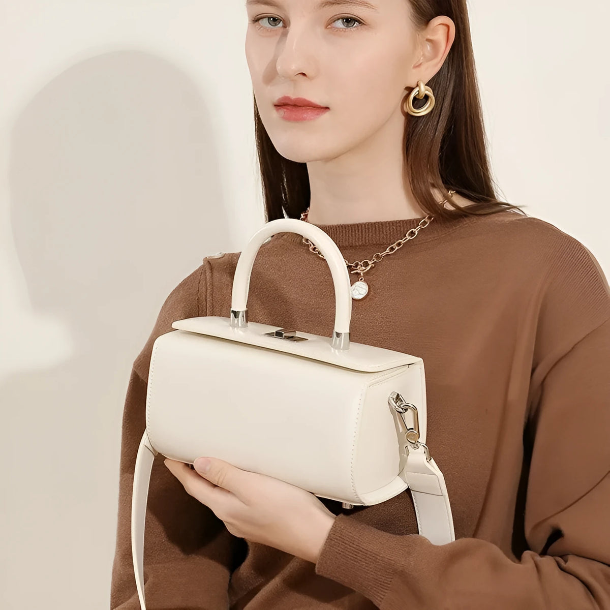 Genuine cowhide leather women's crossbody bag with clamshell opening and internal organisation compartments