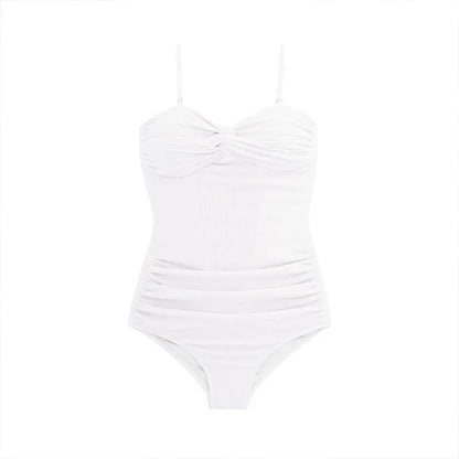 Women's black suspender-style one-piece swimsuit with high waist and push-up lining.