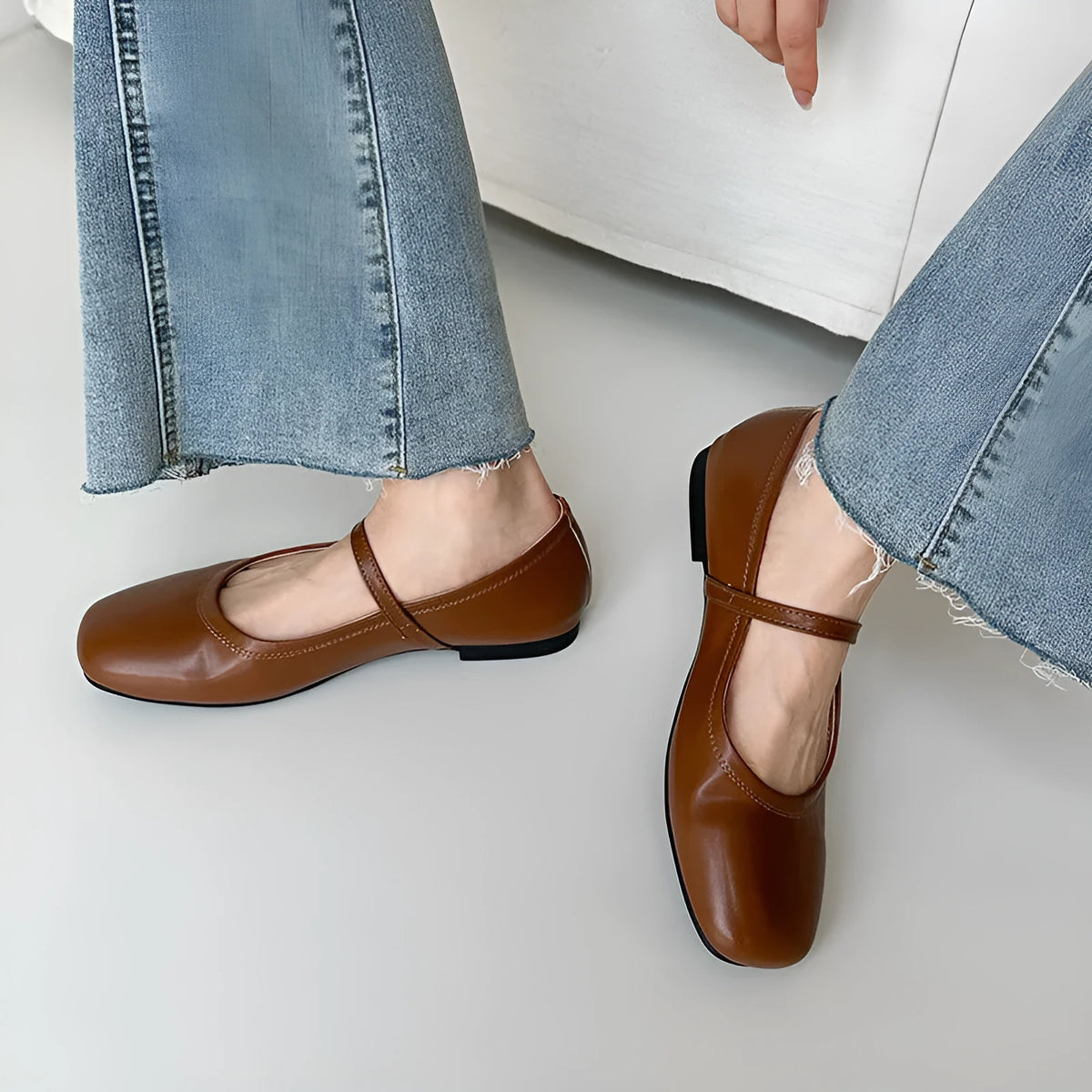 Women's brown sheepskin Mary Jane flat shoes with a round toe and strap