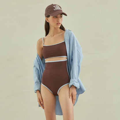 Brown women's one-piece swimsuit with V-neck front and adjustable tie straps at neck and back.