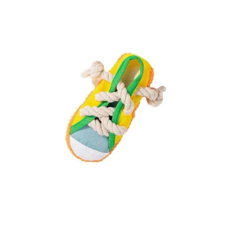 Durable plastic dog chew toy in slipper shape with bends, in yellow, black, or blue.
