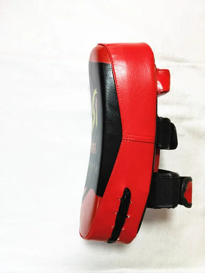 Black with red edges hand-held martial arts target showing 35cm by 19cm striking surface and double adhesive buckle
