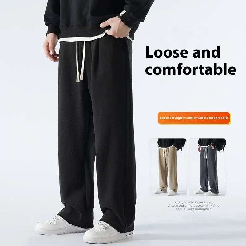 Men's double-sided polar fleece-lined trousers in apricot, black, or dark grey with elastic waist and loose fit for winter.