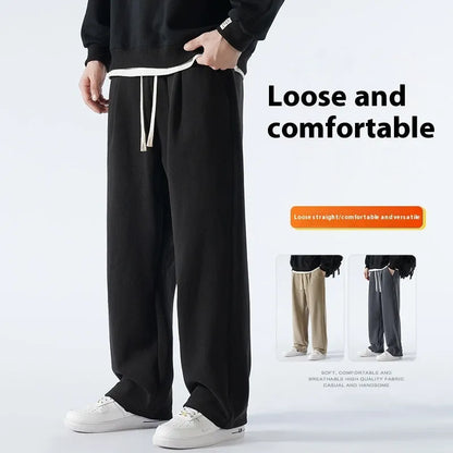 Men's double-sided polar fleece-lined trousers in apricot, black, or dark grey with elastic waist and loose fit for winter.