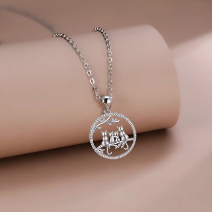 Copper necklace with a four kitten pendant on a cross chain, length 50 cm.