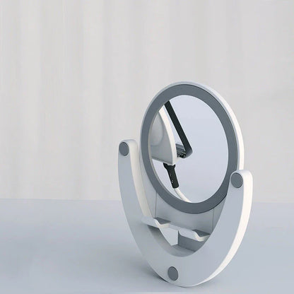 Adjustable mobile phone stand with integrated makeup mirror, featuring a sleek and versatile design for hands-free use and on-the-go touch-ups.