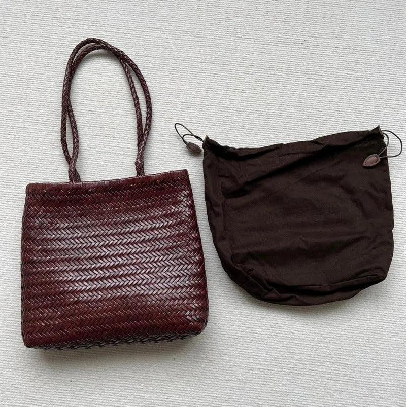 Brown handmade woven leather tote bag with three-dimensional pocket, showing 27cm height and textured cowhide construction