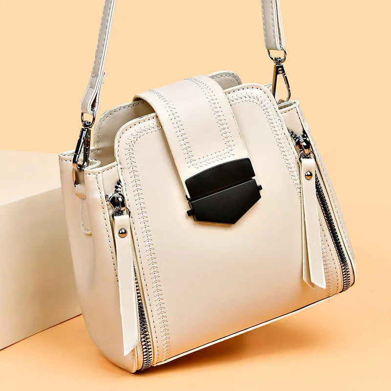 Soft PU leather ladies handbag with textured surface and sewing thread detailing in square vertical shape