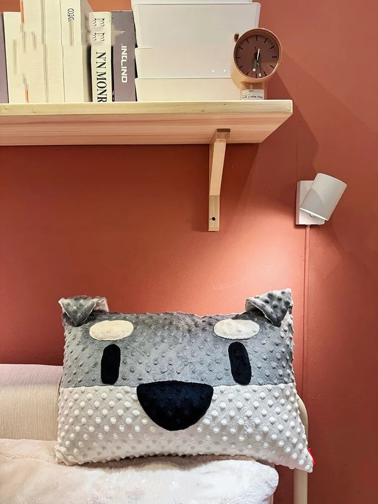 Grey schnauzer print dog pillow cushion on a sofa, measuring 50cm long.
