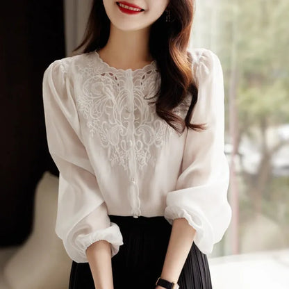 Round neck long sleeve shirt with lantern sleeves and geometric 3D pattern in purple, white, or black, sizes S to 2XL.