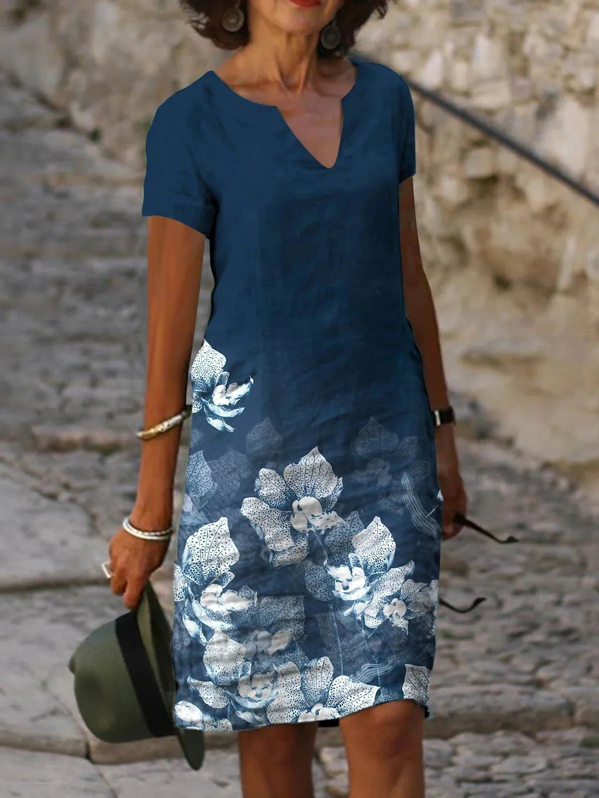 Stylish floral printed mid-length dress made with a cotton-linen blend fabric for a comfortable and feminine look.
