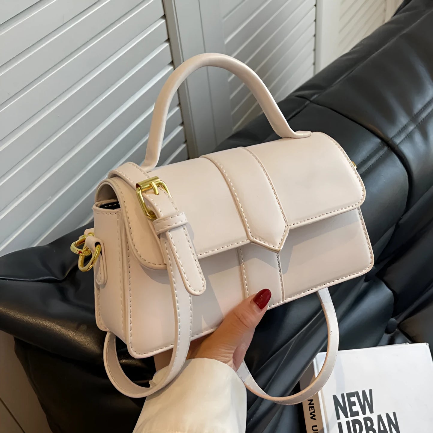 Women's beige messenger bag with horizontal square design showing file compartment and exterior pocket