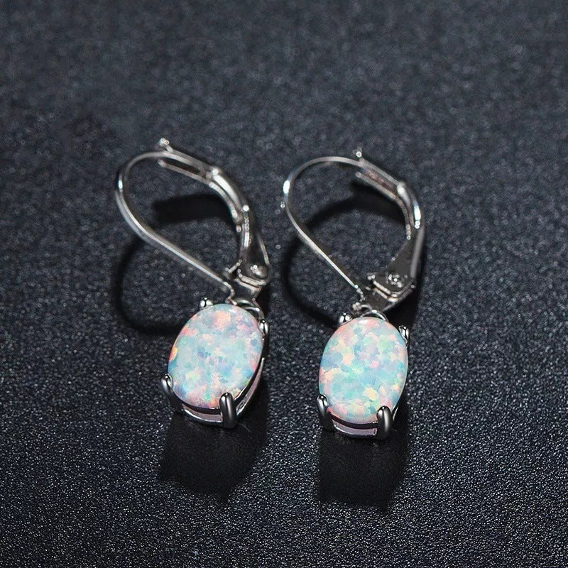 Four-claw oval opal earrings in gold, rose gold, or silver with electroplated finish