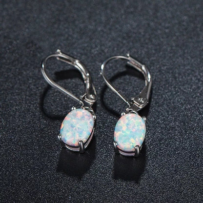 Four-claw oval opal earrings in gold, rose gold, or silver with electroplated finish