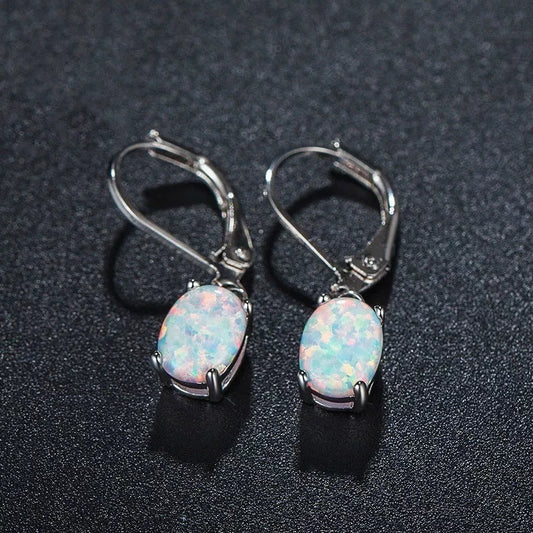 Four-claw oval opal earrings in gold, rose gold, or silver with electroplated finish
