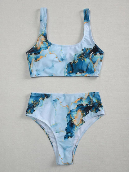 Women's high-waist bikini set with U-neck top in a blue marble tie-dye print.