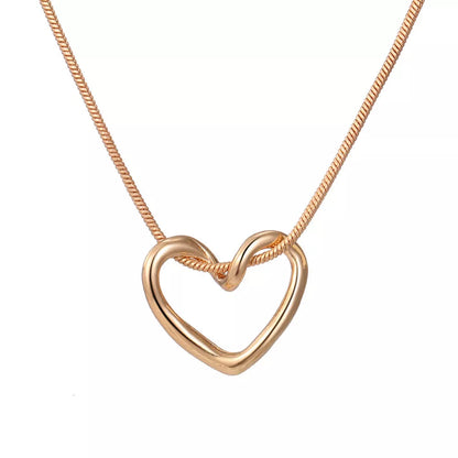 Niche Hollow Heart Necklace for women with snake bones chain and electroplated alloy