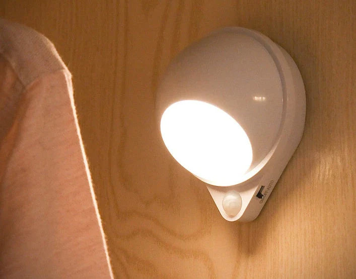 A versatile LED motion sensor night light with a 360-degree rotating head, perfect for illuminating any space in your home or office.