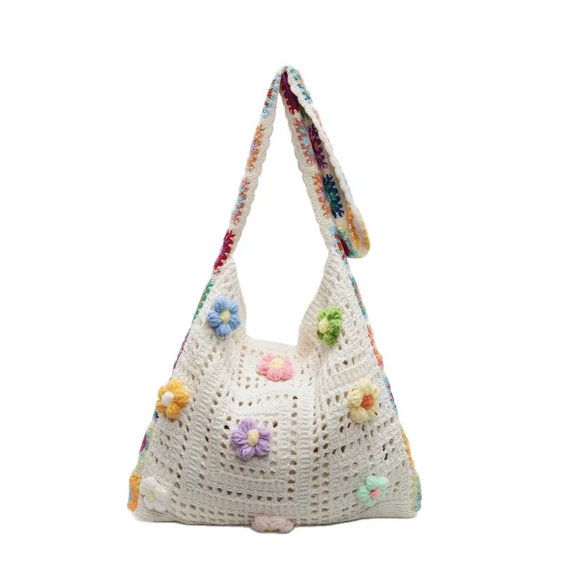 Woven polyester shoulder bag showing hollow knitting texture and single 41cm strap in neutral colour