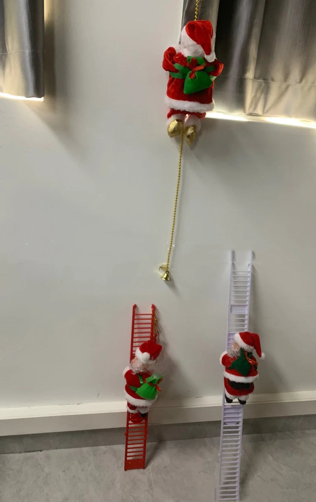 Electric plastic Santa Claus on 30cm climbing ladder with riding deer, in red suit, for Christmas decorations